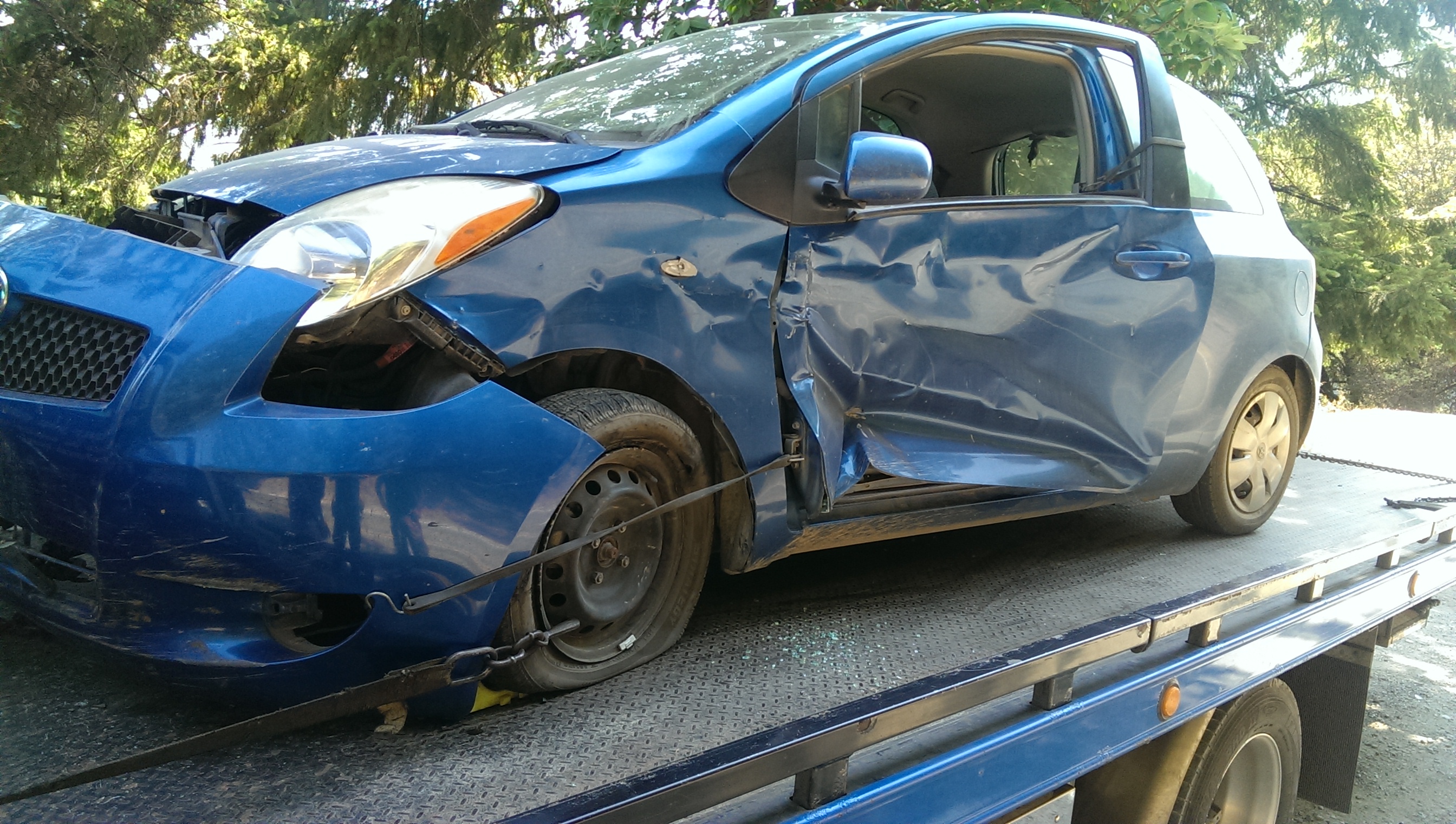 Blue car with visible damages